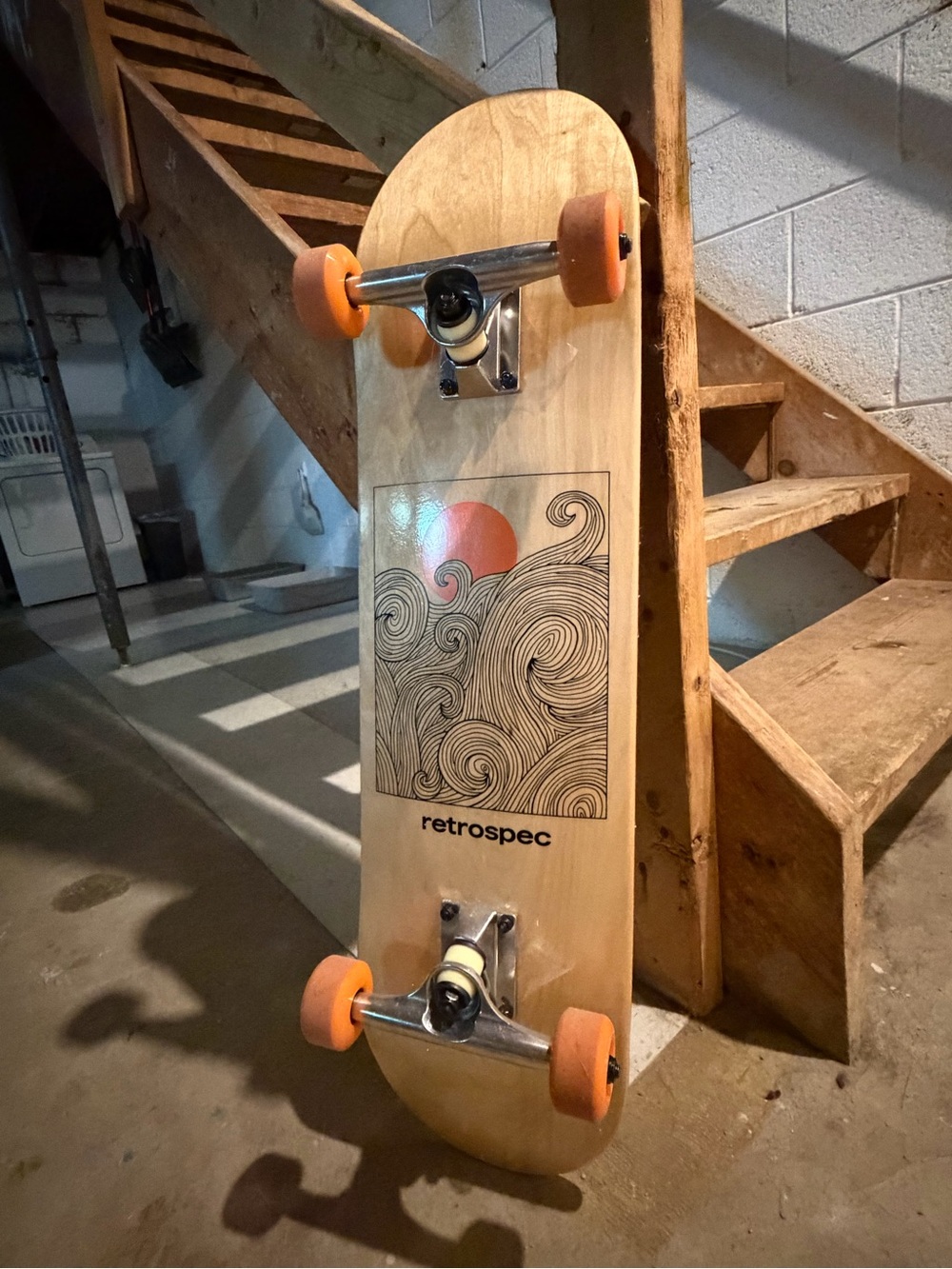 Retrospec Natural Wood Cruiser Skateboard with Orange Wheels and Wave Graphic
